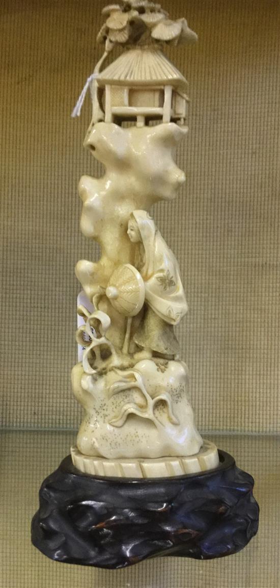 Japanese walrus ivory okimono, early 20th century repair to top, wood stand(-)